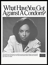 A poster promotes condom use. A black woman with one hand on her arm looks directly at Wellcome L0052333.jpg