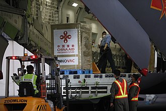 A Chinese military transport vehicle dropping off Sinovac's "CoronaVac" in Villamor Air Base in preparation for the mass vaccination in the Philippines A forklift off-loads boxes of vaccines from a Chinese military aircraft at the Villamor Air Base.jpg
