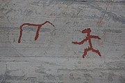 English: Rock art in the world heritage area in Alta, Norway. This is from the area Bergbukten 1, a group of some 900 figures. 23-25 m above sea level, and 6000-7000 years old.