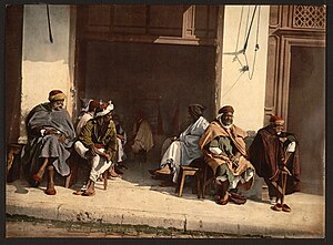 Arabs before a cafe, Algiers, Algeria-LCCN2001697837.jpg