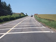 Series of French transverse rumble strips after a dangerous crossroads Bandes rugueuses transversales.jpg