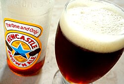 A glass of Newcastle Brown Ale Bottle of Newcastle Brown Ale poured.jpg