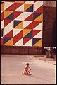 CHILDREN PLAY BENEATH EYE-CATCHING MURAL IN A SMALL CITY PARK ON THE CORNER OF 29TH STREET AND SECOND AVENUE IN... - NARA - 551727.jpg