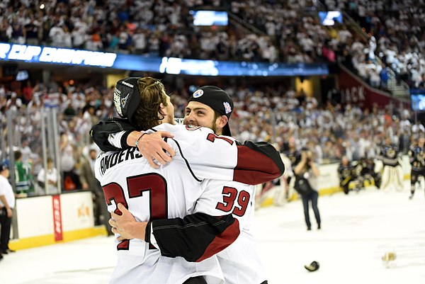 Chaput celebrating the Monsters Calder Cup victory with Josh Anderson.