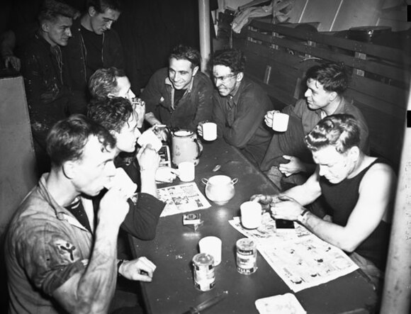 Stand easy in the stoker's mess of the corvette HMCS Kamsack, 1943