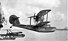 A Supermarine Walrus amphibian airplane being launched from the catapult deck of HMS Bermuda, an example of the type use HMS Bermuda aircraft (cropped).jpg