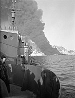 Thick clouds of black smoke as seen from Legion, during the expedition to the Lofoten islands, Norway, where troops were landed to blow up the oil tanks HMS Legion Lofoten raids.jpg