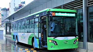 Green bus on a rainy day