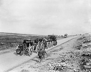 A Holt caterpillar tractor hauling a 9.2-inch howitzer on the Somme, summer 1916. Holt tractor hauling a 9.2 inch Howitzer to a forward area.jpg