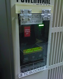 An emergency stop button with a custom-made plastic molly guard to prevent it from being pressed accidentally Homemade Mollyguard.jpg