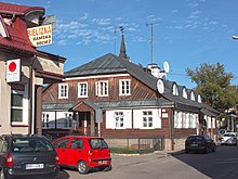 A wooden inn called Słuszna near the marketplace and town hall