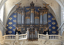 Photographie présentant la tribune d'orgue, à l'extrémité ouest de la nef.