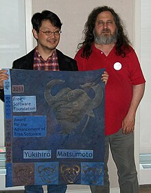 Yukihiro Matsumoto accepting the 2011 Advancement of Free Software award from former FSF president Richard Stallman Matz.jpg