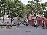 Morales 24 - Plaça del Carme 4, a les Corts. Edifici amb protecció documental (nivell D) com a part del conjunt de la plaça del Carme.