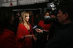 Nastia Liukin, em 2009, numa entrevista na New York Fashion Week, na qual desfilou pela coleção The Heart Truth's Red Dress Collection da Max Azria.