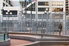 A Minnesota National Guard trooper and security fencing at Hennepin County Government Center during the criminal trial, April 2, 2021 National Guard, Minneapolis (51092792971).jpg