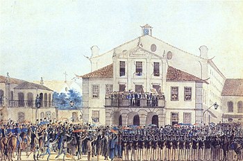 Colored sketch depicting a crowd of civilian and military figures standing and waving before the crowded balcony of a pedimented building with people looking on from its windows