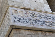 Inscription in Lombardic Capitals on the campanile of Santa Chiara, Naples ParticolareCampanileSantaChiara.jpg