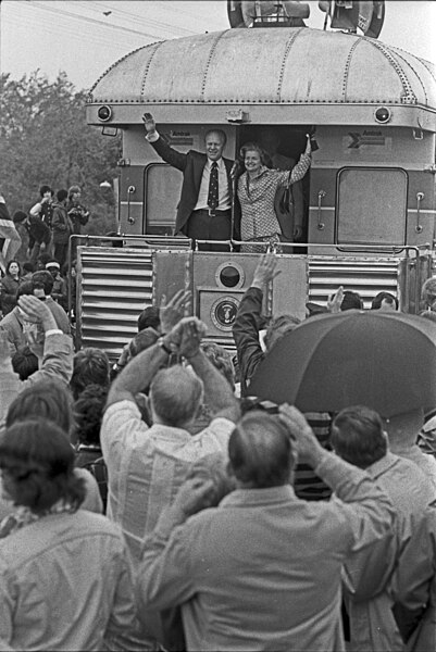 File:President and Mrs. Ford wave during their primary campaign in Michigan - NARA - 7027911.jpg