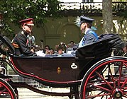 On a horse-drawn carriage with Prince Harry (now Duke of Sussex) 2010