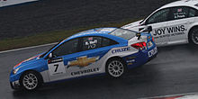 Robert Huff (Chevrolet Cruze) placed third in the Drivers Championship Robert Huff overtaking Andy Priaulx 2010 WTCC Race of Japan (Race 1).jpg