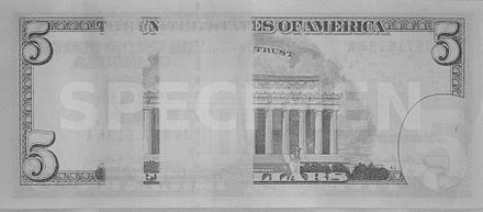 The reverse of the United States five-dollar bill has two rectangular strips that are blanked out when viewed in the infrared spectrum, as seen in this image taken by an infrared camera.
