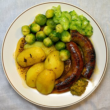 A simple Dutch meal traditionally consists of meat, potatoes, butter, a boiled vegetable, and salad.
