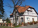 Country house with farm buildings and fencing