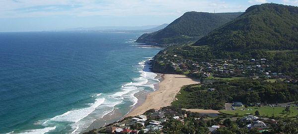 View from Bald Hill lookout, with Lawrence Hargrave Drive visible following the coast towards Wollongong and the Sea Cliff Bridge on the second headla