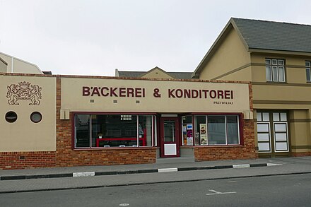 A typical storefront in Swakopmund, Namibia written in the former colonial German language.