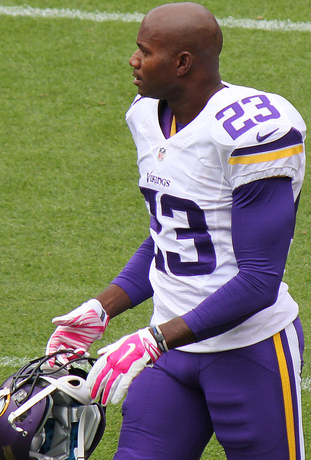 Terence Newman of the Dallas Cowboys adjusts his helmet during the