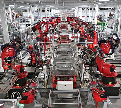 Robots assembling cars.