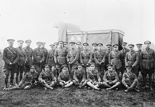 Lieutenant-Colonel John Hamilton Hall (standing directly in front of the Red Cross on the ambulance), the CO of the 1st Battalion, Middlesex Regiment 