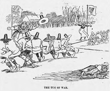 Cartoon by J. M. Staniforth depicting the Ireland--Wales game of 18 March 1899 as a tug-of-war; the Welsh team wear Welsh hats. The Tug of War - JM Staniforth.png