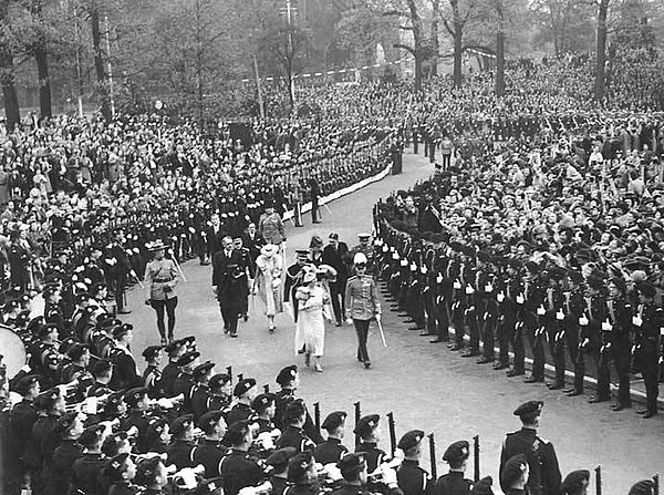 George VI and his royal consort, Queen Elizabeth, walking through Queen's Park, Toronto, May 1939