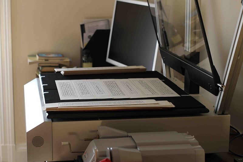 File:Tibetan texts and a planetary book scanner; microfilm scanner on the bottom.jpg