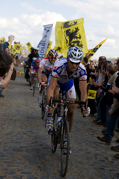Tom Boonen followed by Fabian Cancellara in 2008 Paris–Roubaix, one of the classic cycle races.