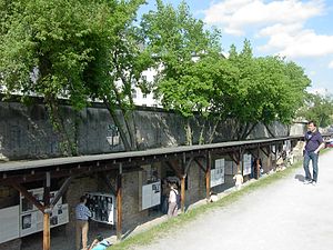 Part of the Topography of Terror museum. The preserved section of the Berlin Wall can be seen at the top of the picture, 2006 Topography of Terror - Berlin Wall.JPG