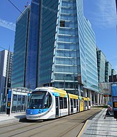 The West Midlands Metro is the growing tram system in Birmingham. Tram at St Chads stop (2) May19.jpg