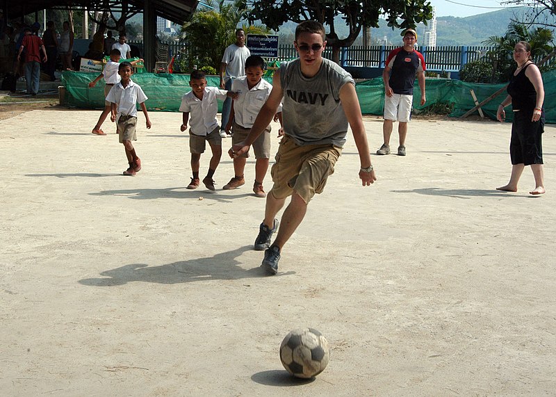 File:US Navy 050301-N-8955H-096 Information Systems Technician Seaman Apprentice Tyler Montgomery of Dayton, Ohio, plays soccer with students during a community service project at Kamala Primary School in Kamala, Thailand.jpg