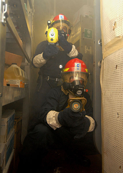 File:US Navy 080217-N-5476H-043 Damage Controlman 3rd Jason Gilberti operates a naval fire fighting thermal imager while Damage Controlman 3rd Class Duane Cunningham operates the fire hose nozzle during a damage control drill aboard.jpg