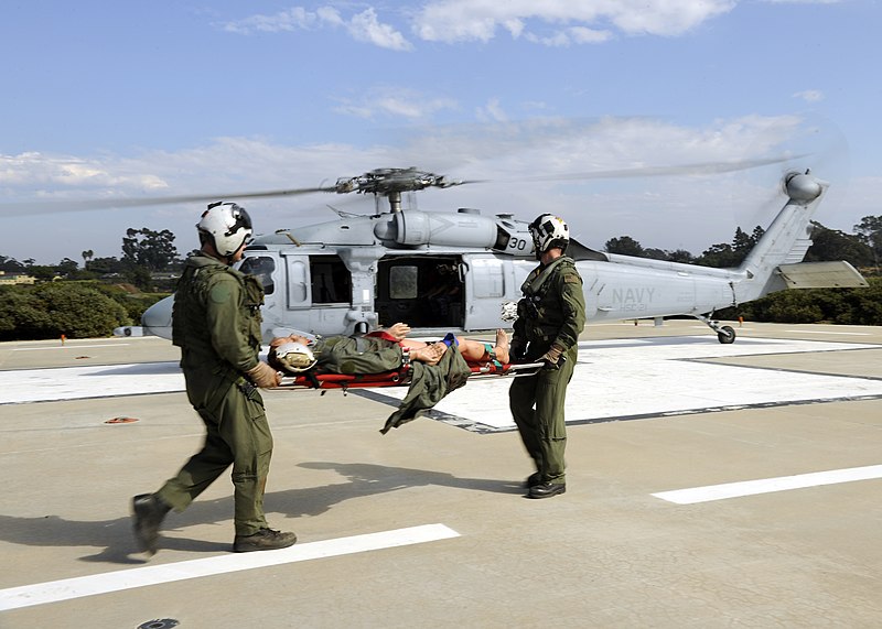 File:US Navy 110922-N-UB993-147 Air crewmen prepare to load a training mannequin onto an MH-60S Sea Hawk helicopter assigned to the Blackjacks of Helico.jpg