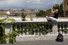 A young Danish tourist girl enjoys the view of Rome from Monte Gianicolo, Rome, Italy