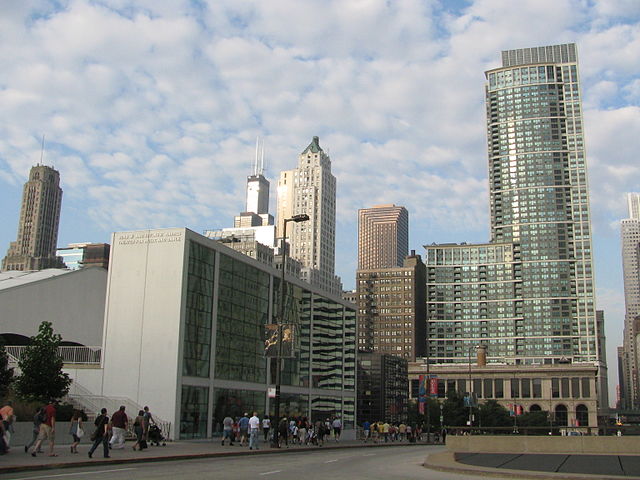 Harris Theater (left), the Chicago Cultural Center (bottom right), and The Heritage at Millennium Park (upper right) from Randolph Street.
