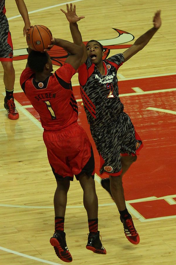 Harrison defending against Wayne Selden in the 2013 McDonald's All-American Boys Game