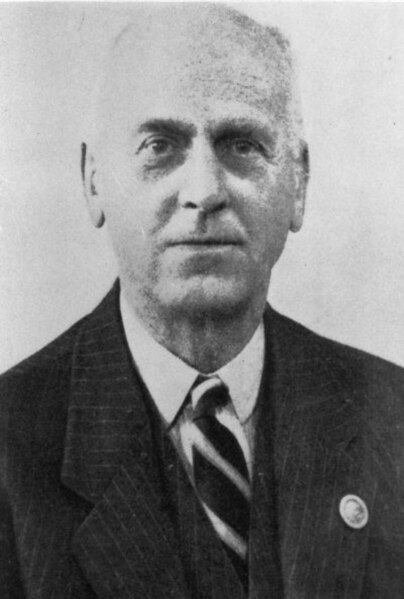 Air Commodore Edward Masterman, pictured wearing an early Observer Corps lapel badge on his suit jacket.