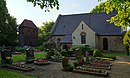 Village church with sandstone tombs