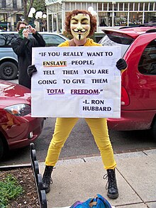 Anonymous protester demonstrating during January 2009 raid outside the Founding Church of Scientology in Washington, D.C. Anonymous DC January 2009 raid.jpg