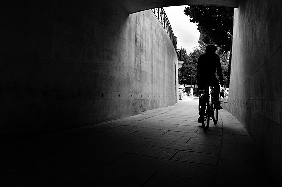 Biker in a Parisian underpass.