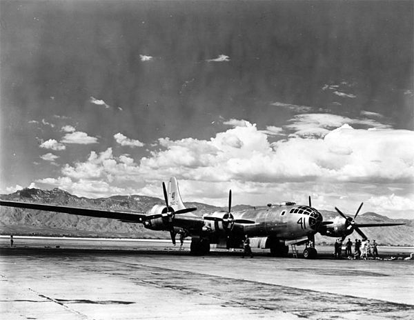 The length of the 141-foot (43 m) wing span of a Boeing B-29 Superfortress based at Davis-Monthan Field is vividly illustrated here with the cloud-top